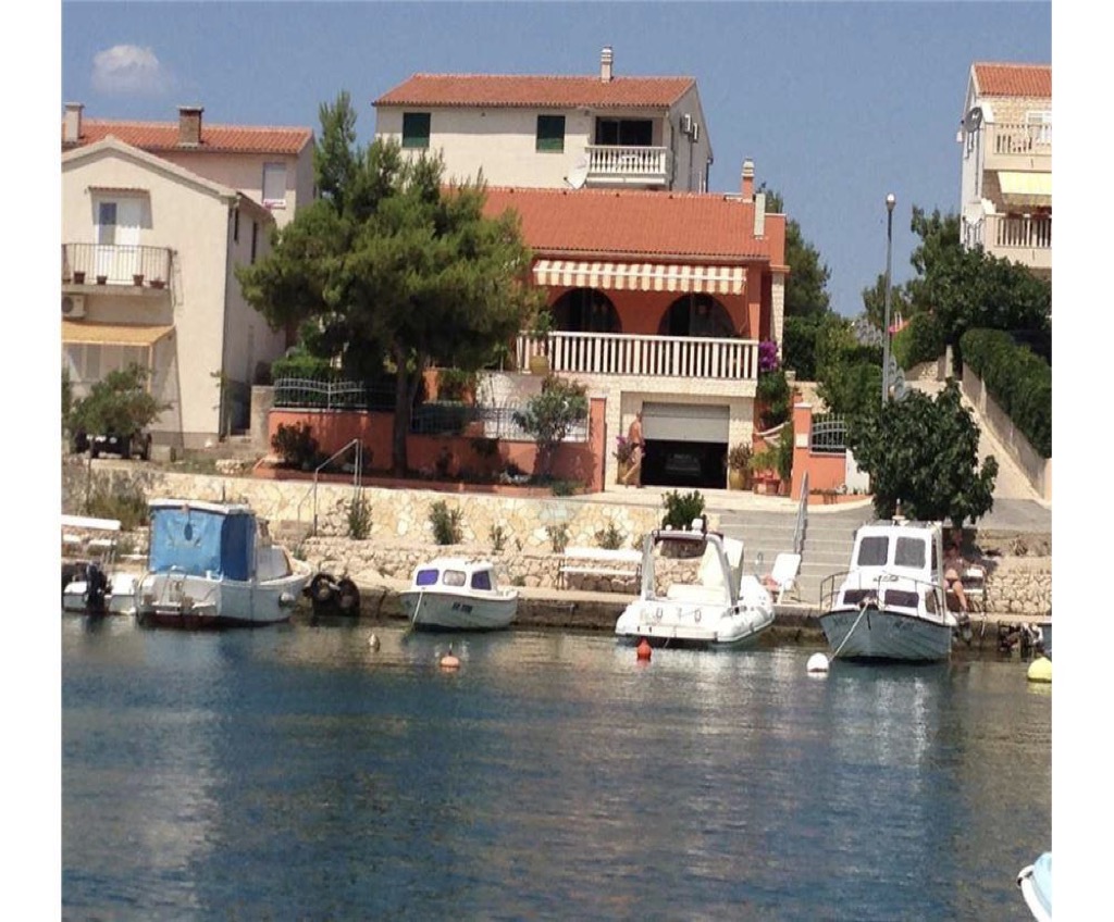 Seafront house for sale in Sibenik, waterfront with boat dock